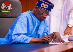 tinubu-writes-signs-1536x1097-1